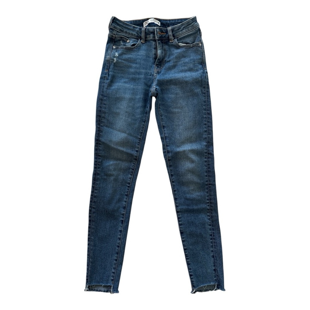 Title: High-Rise Skinny Jeans with Distressed Hem